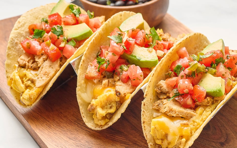 Three wheat-corn tortillas with scrambled cage-free eggs, Cajun chicken, chorizo, Cheddar and Monterey Jack. Topped with fresh avocado and housemade pico de gallo. Served with seasoned black beans.