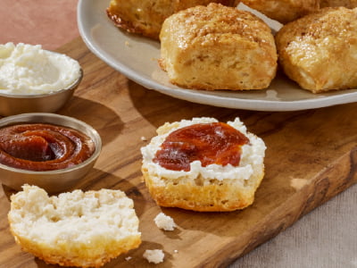 Warm biscuits served with apple butter and whipped butter.