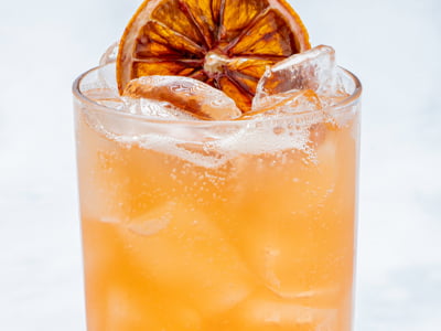 Blood orange puree, filtered sparkling water and a dried blood orange wheel.