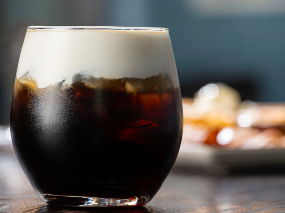Served our way, over ice. Cold brew coffee and New Amsterdam 5X Distilled Vodka, topped with creamy cold foam and a dusting of hot chocolate powder.