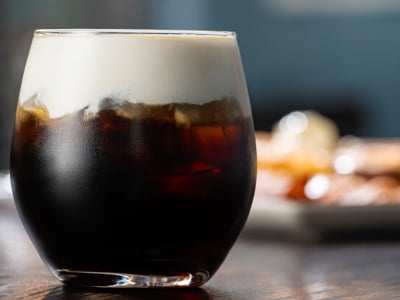 Served our way, over ice. Cold brew coffee and New Amsterdam 5X Distilled Vodka, topped with creamy cold foam and a dusting of hot chocolate powder.
