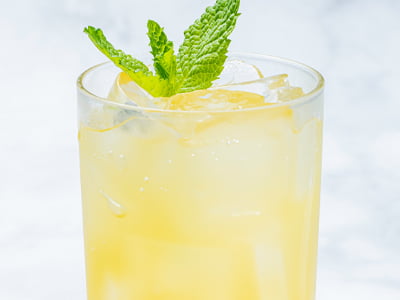 Passion fruit puree, filtered sparkling water and a mint sprig.