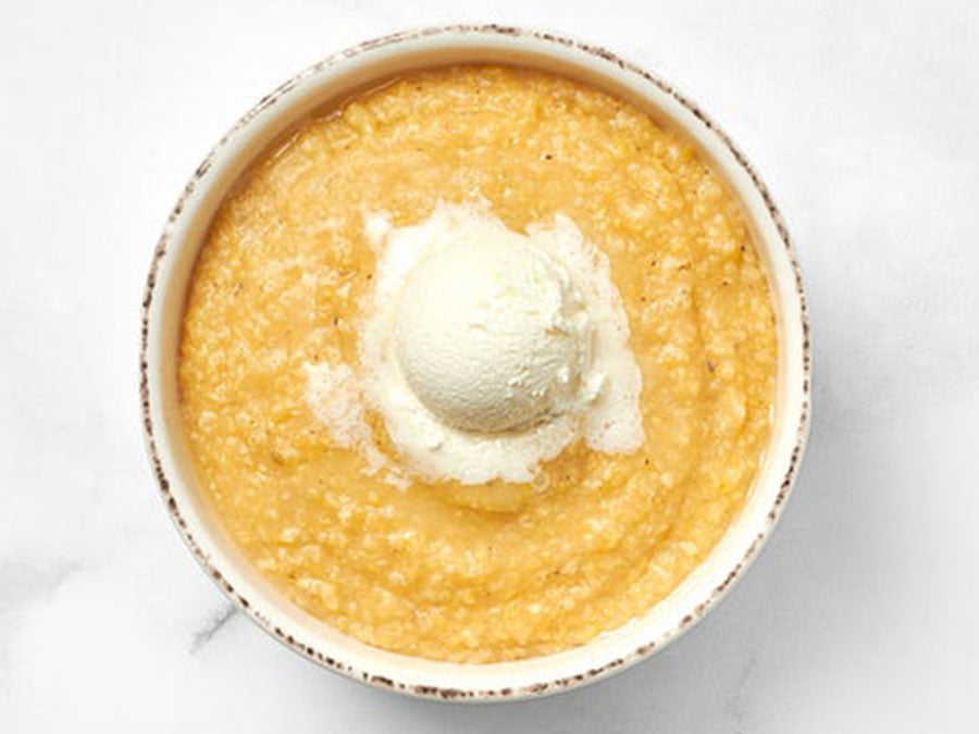 A simple bowl of plain grits served hot.