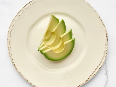 A side of freshly sliced avocado.