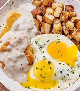 Biscuits and Turkey Sausage Gravy with Eggs | First Watch